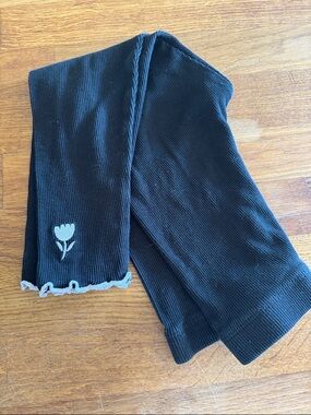 Primark Black Ribbed Knit Leggings with White Trim and Embroidered Flower